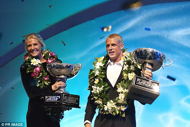 2009 ASP World Champions Stephanie Gilmore from Tweed Heads (left) and Mick Fanning, also from Tweed Heads, pose after receiving their ASP World Title Trophies