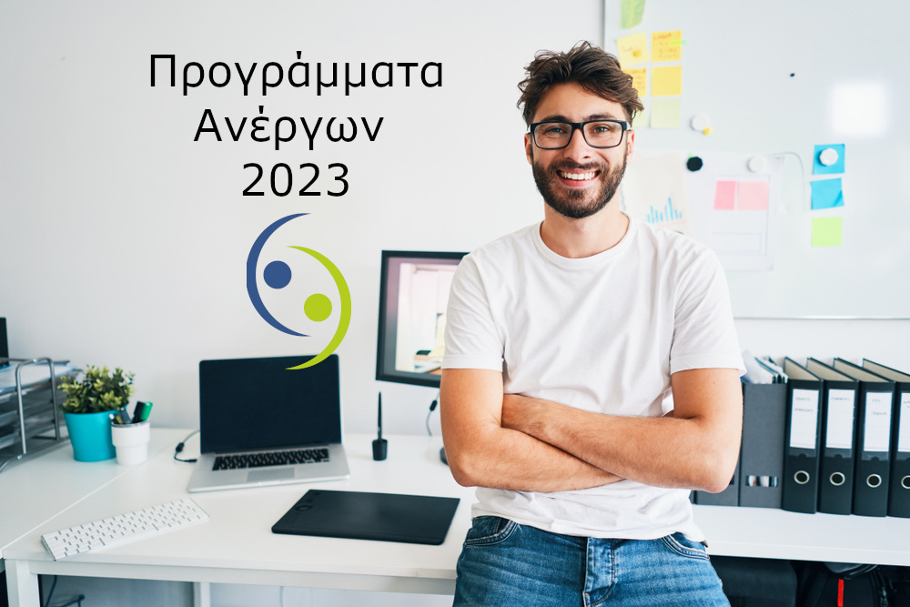 Portrait,Of,Confident,Graphic,Designer,Leaning,On,Desk,In,Office