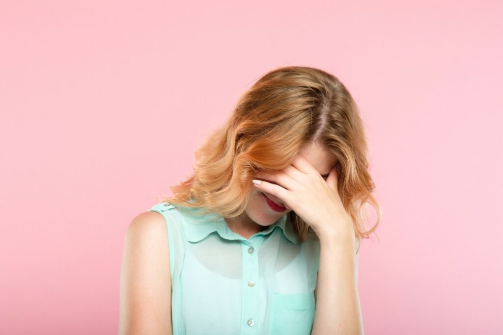 Facepalm,Embarrassment,And,Shame,Emotion.,Ashamed,Smiling,Girl,Covering,Her